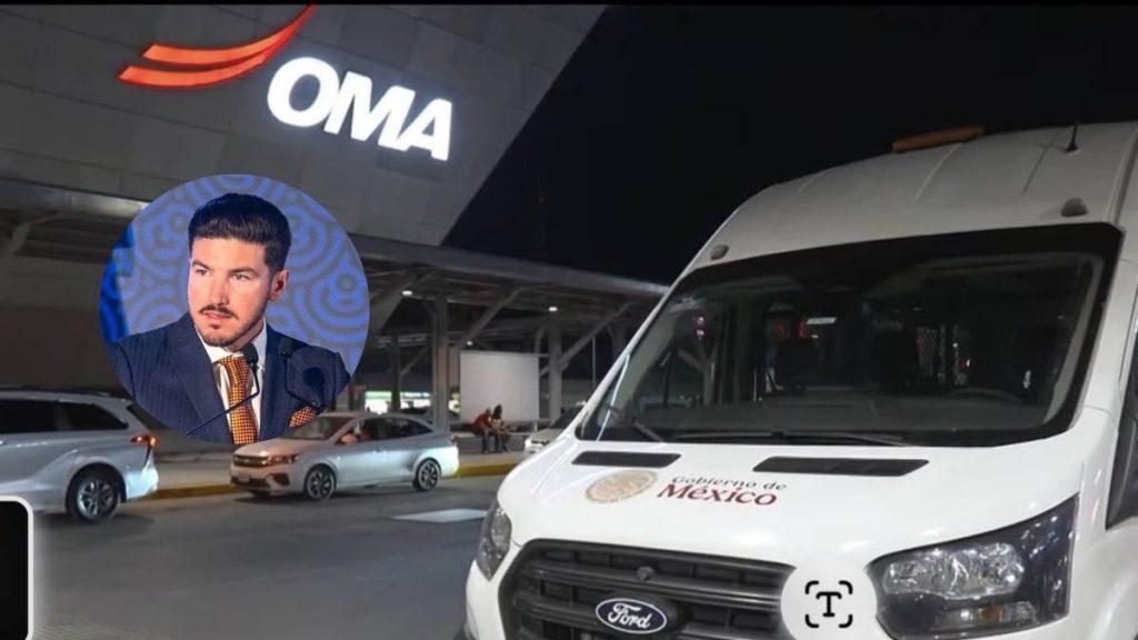 el-aeropuerto-de-la-sede-del-mundial-falla - Minuto Cero Night shot of a white Ford van with 'Gobierno de Mexico' logo at a modern facility/logo reading 'OMA' in the background; blue circular inset shows a man in a suit speaking at a microphone.