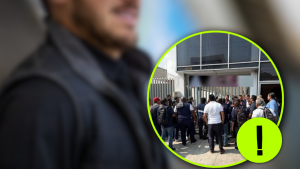 Crowd of people gathered at a gated building entrance, with a neon-green circular highlight and a warning exclamation mark overlay indicating alert or caution.